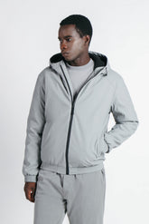 GIUBBOTTO TECNICO CON CAPPUCCIO GRIGIO